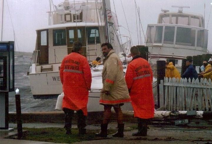 Assistant Chief Shep Simmons with members of the RI State Police during a hurricane. Sadly, Shep died in 1996. Our current Engine 102 proudly bares the name &quot;The Shepard&quot; in his honor. 